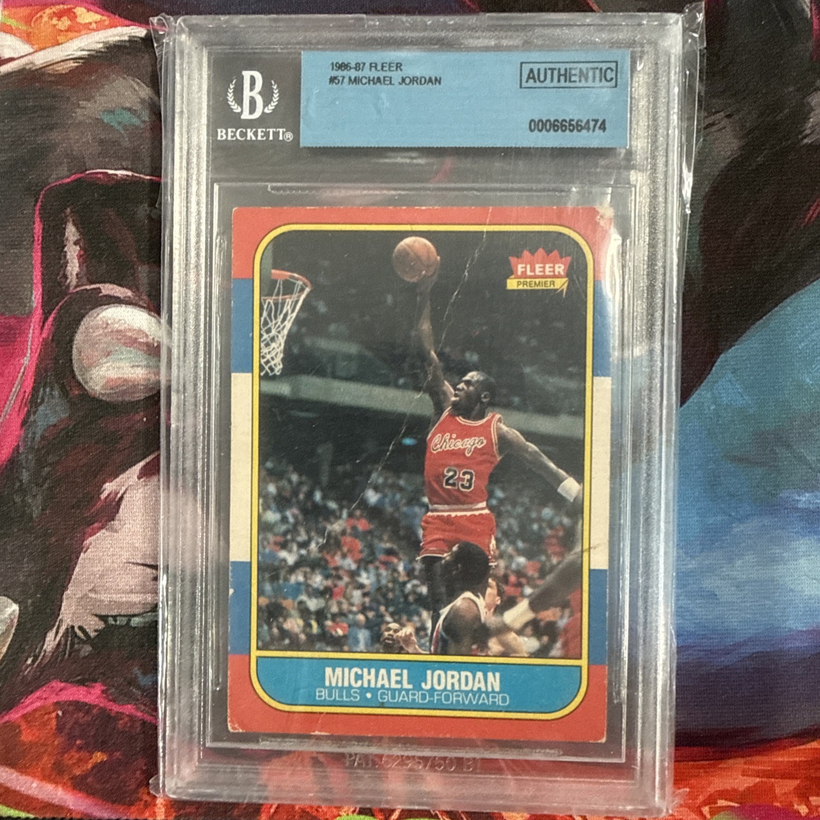 1986 Fleer #57 Michael Jordan rookie card, encapsulated by Beckett as Authentic with no numeric grade, sold for $4,700 on eBay