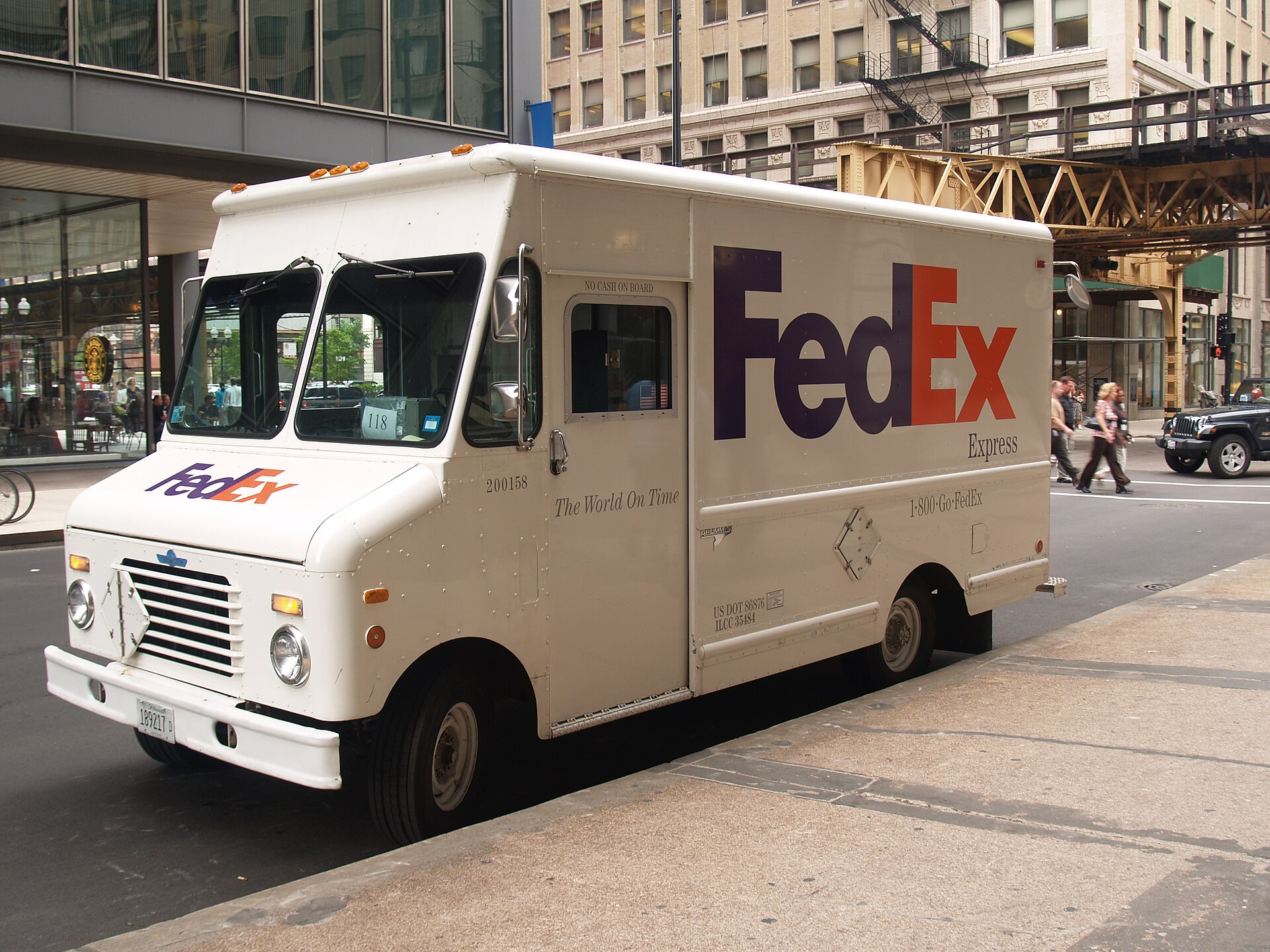 FedEx delivery truck parked on a city street
