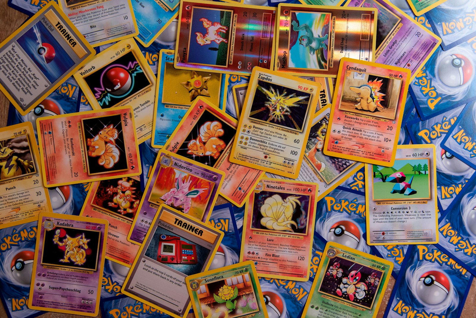 Pokémon trading cards scattered on a table